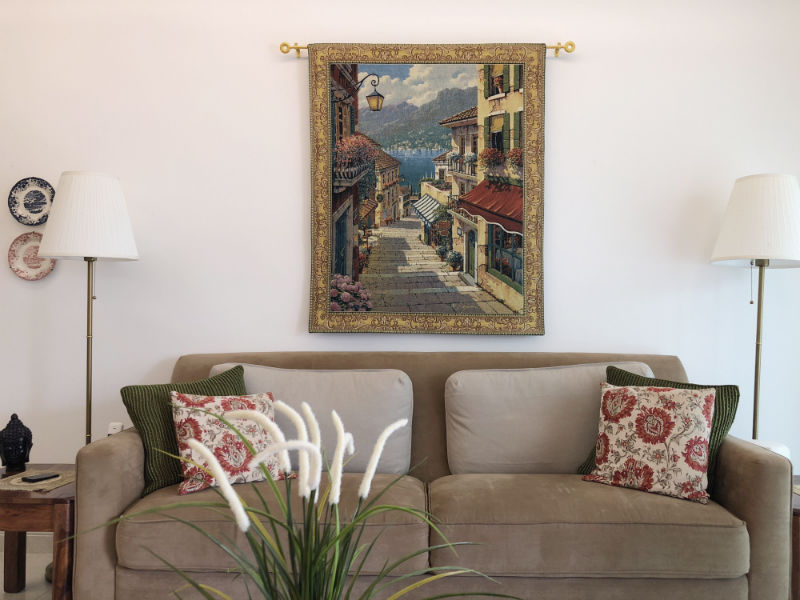 Bellagio Village tapestry hanging in a home